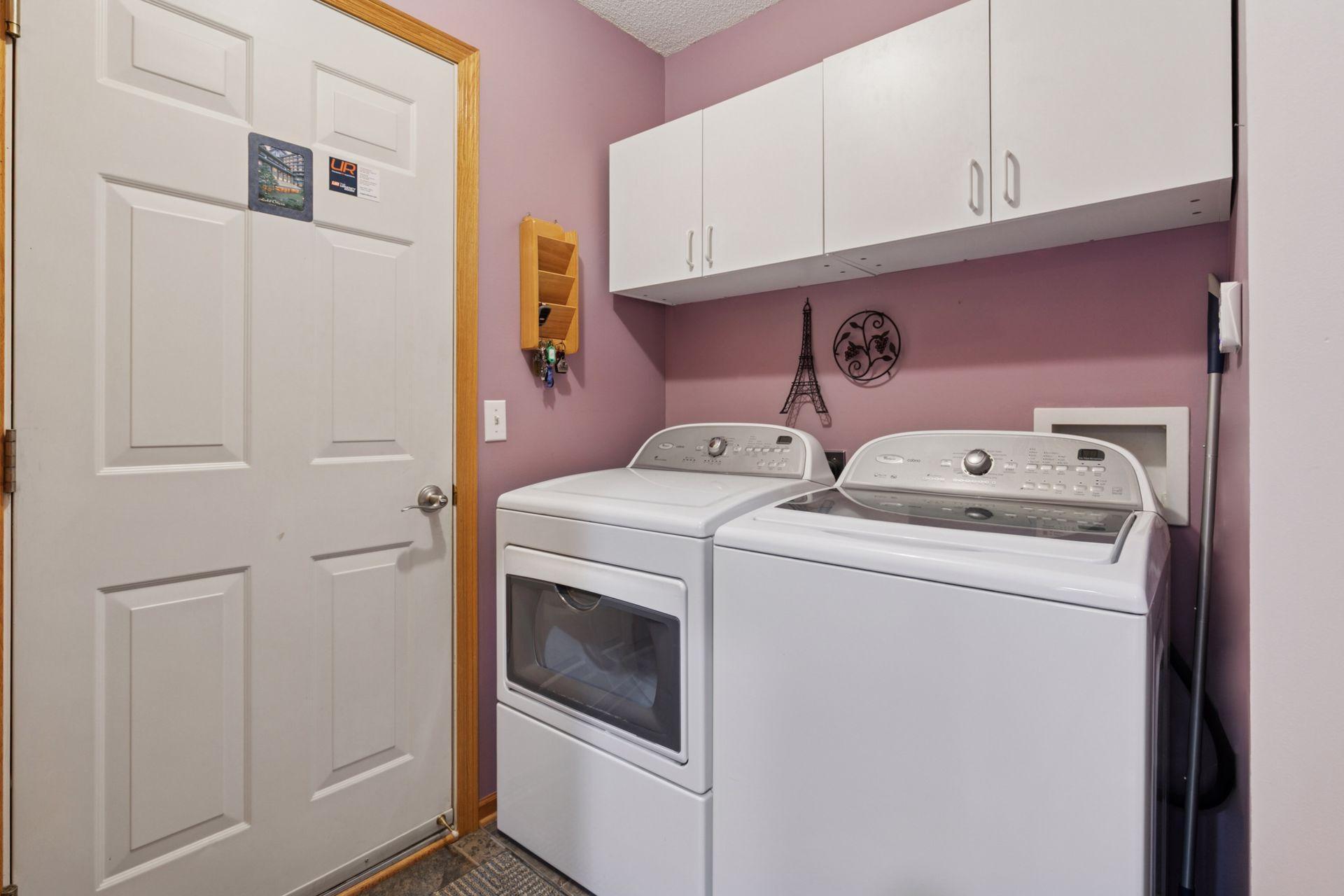 The sought after main floor laundry with ample cupboards, linen closet and another "hidden closet" that is 5' X 6'. Exit to the 19.5 X 19.5' garage. There is a water spigot in the garage.