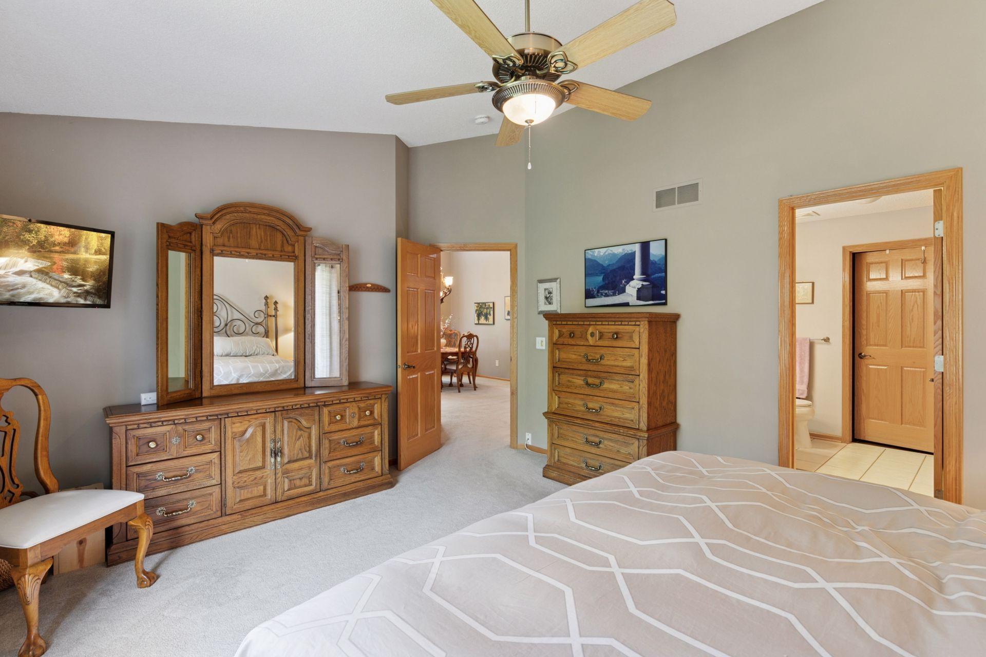 Natural light even flows in from the dining room. Large furniture placement is no problem and a private ensuite bath with walk-in closet is ideal.