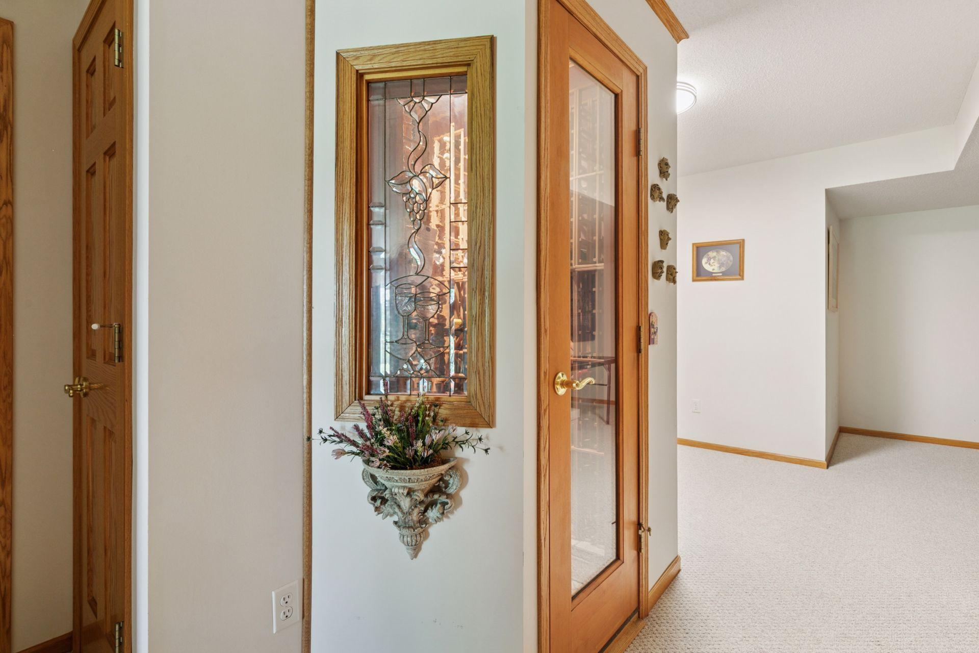 If you live on "Merlot Curve', you must have a wine cellar! The open space in the back of the picture is a continuation of the ping pong room and measures 7' X 7'.