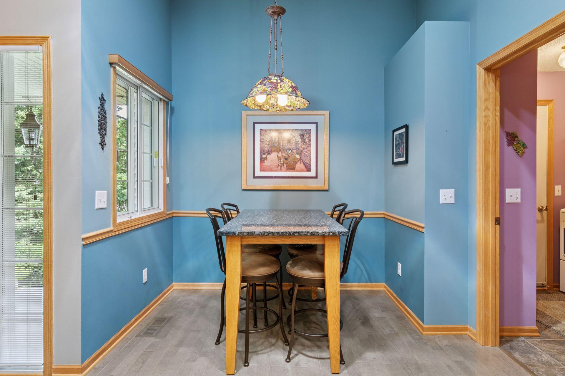Of course, there is also natural light! The front door and the window in this breakfast/dining area are perfect for morning meals. The room on the right is the main floor laundry.