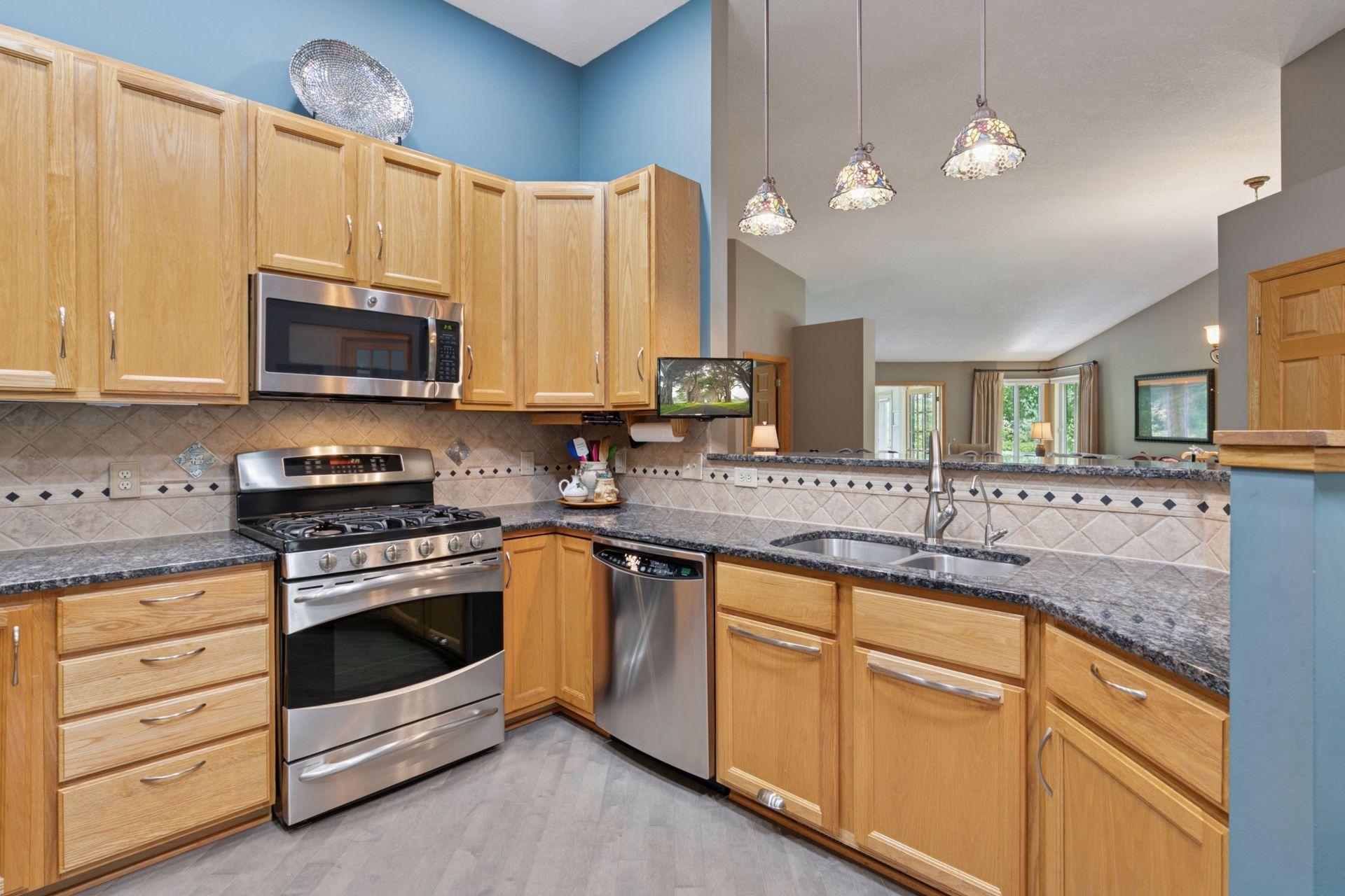 A beautiful kitchen just shines with granite tops and stainless steel appliances. Enjoy the warm look of the wood floors. Watch throughout the home for expertly done stone and ceramic tile.