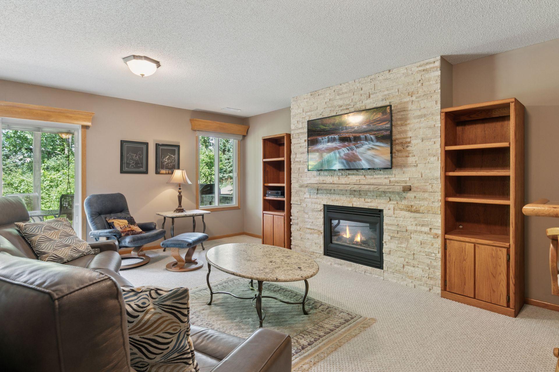 Here you can see the walk-out and extra window which brings in natural light. Easily access this very usable yard and patio.