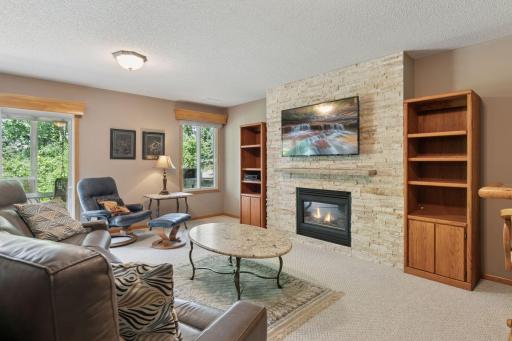 Here you can see the walk-out and extra window which brings in natural light. Easily access this very usable yard and patio.