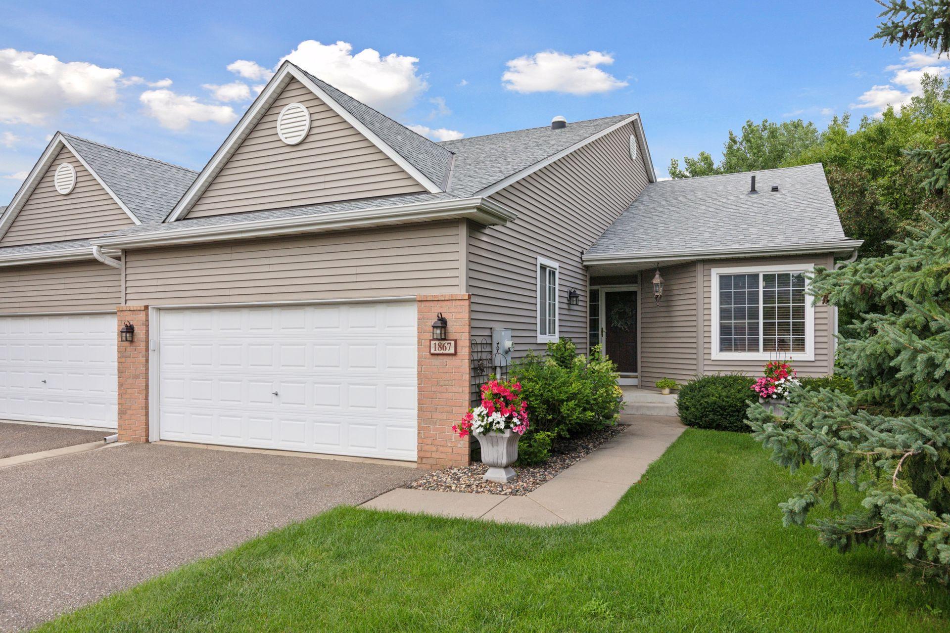 To make it an even smarter choice, this home is landscaped beautifully, the garage has a window, a roof overhang at the front door, a flat driveway, gutters, and it is very good looking from the street.