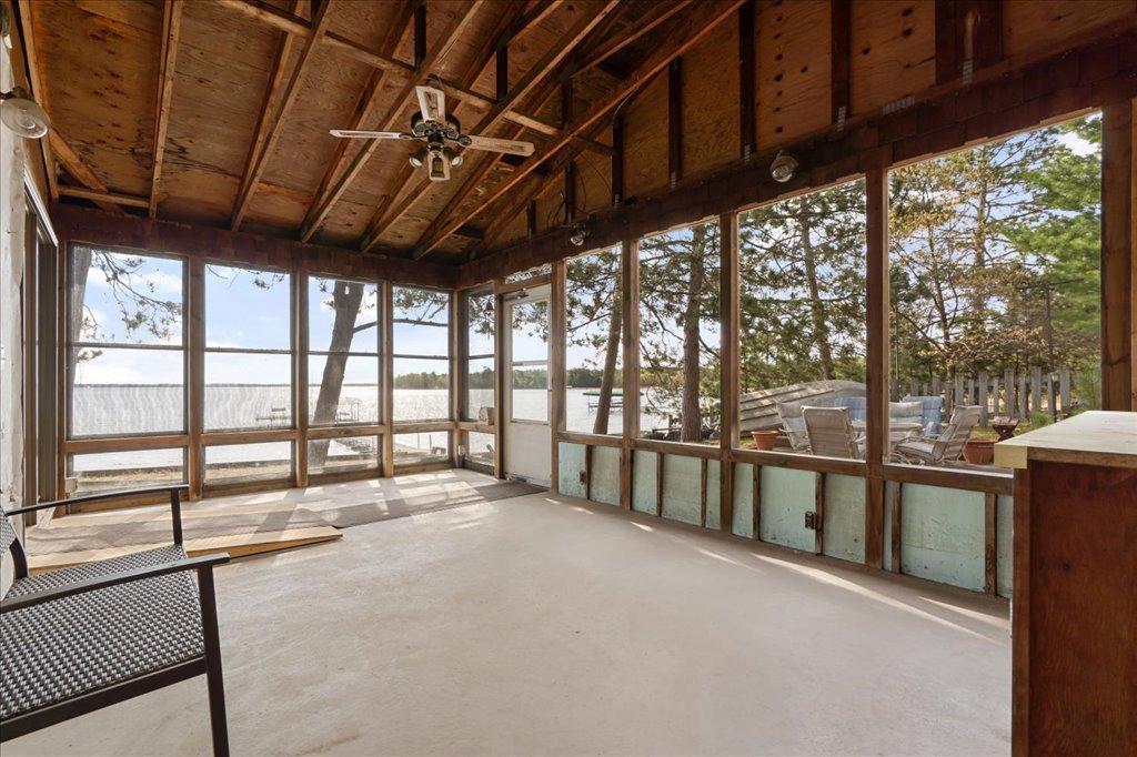 Screened porch with lake views and direct access to the lakeside patio.