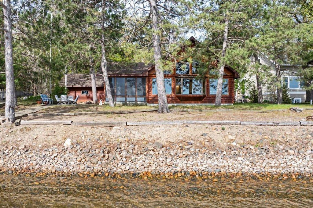 East-facing shoreline with mature pines and panoramic lake views.