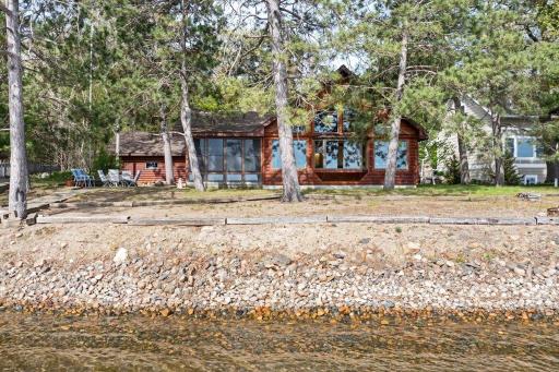 East-facing shoreline with mature pines and panoramic lake views.