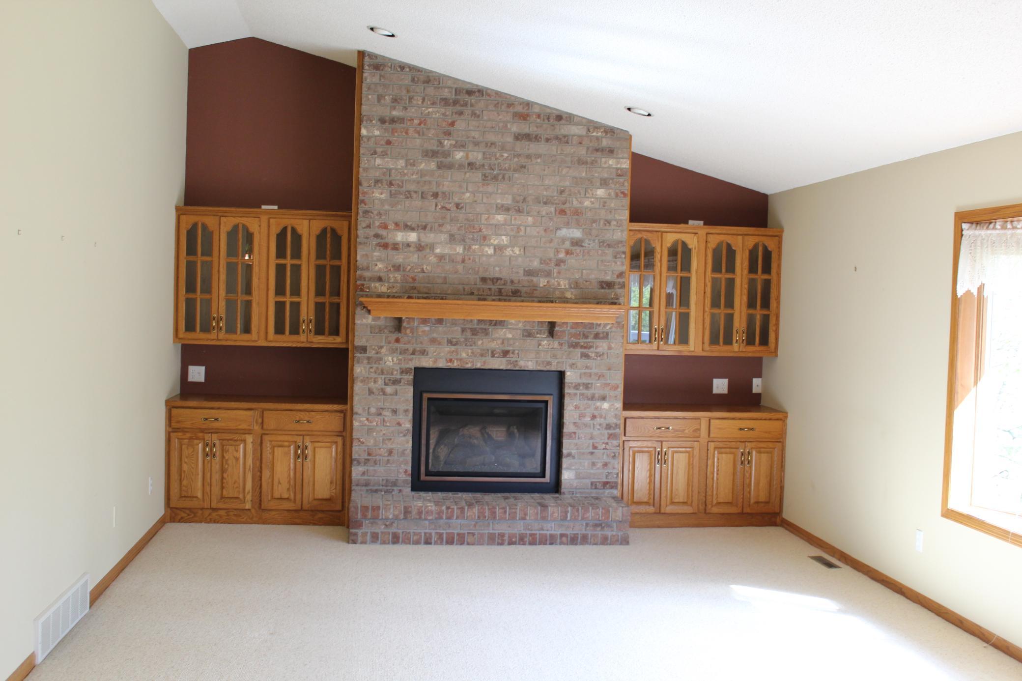 large family room fireplace with displays
