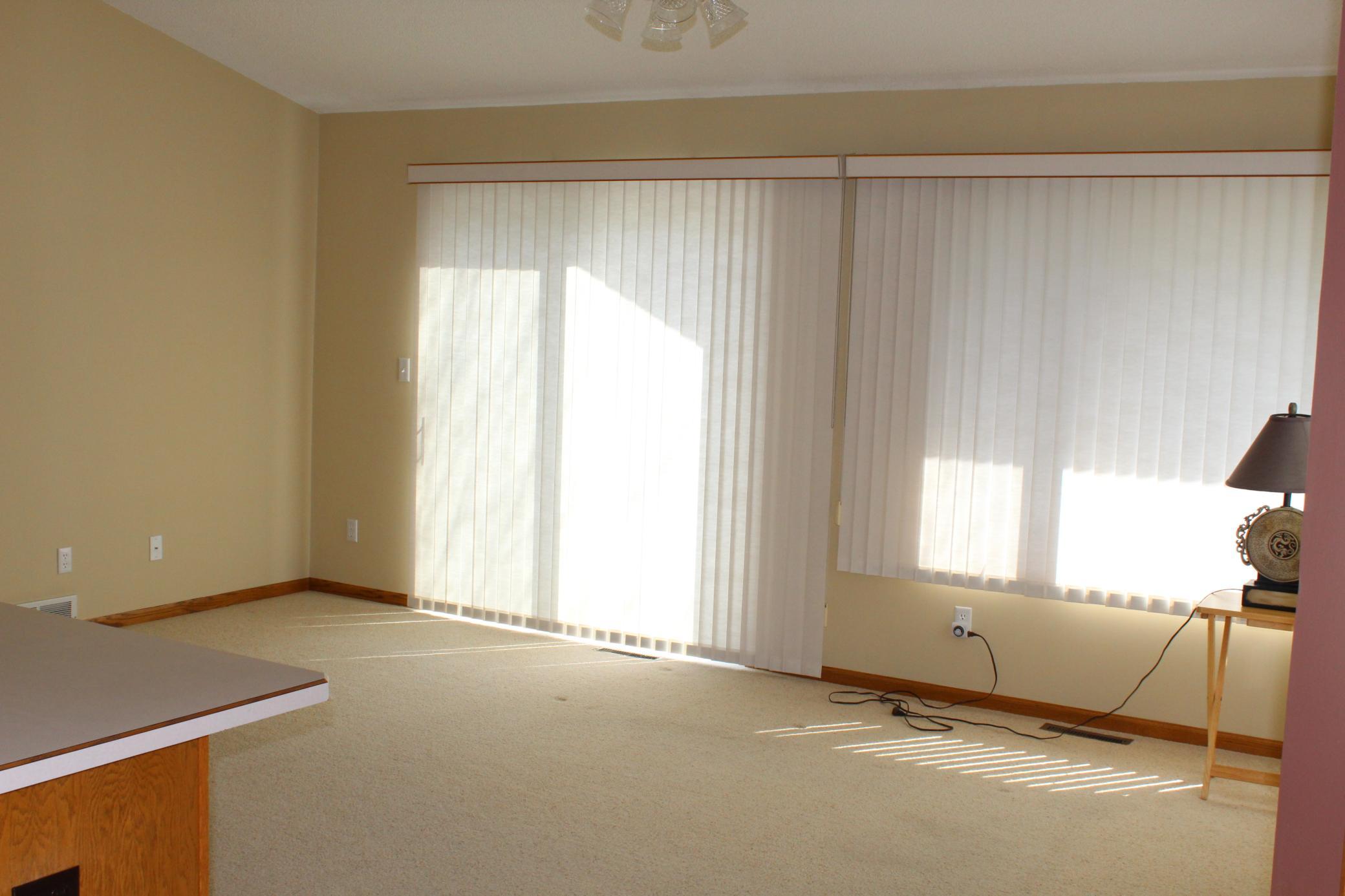 large sunny room from kitchen area