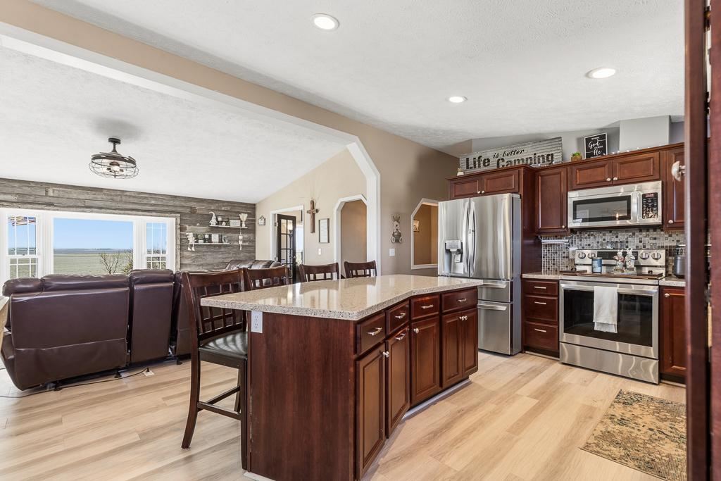 The center island adds prep space, storage, and a casual seating arrangement for those less formal meals.