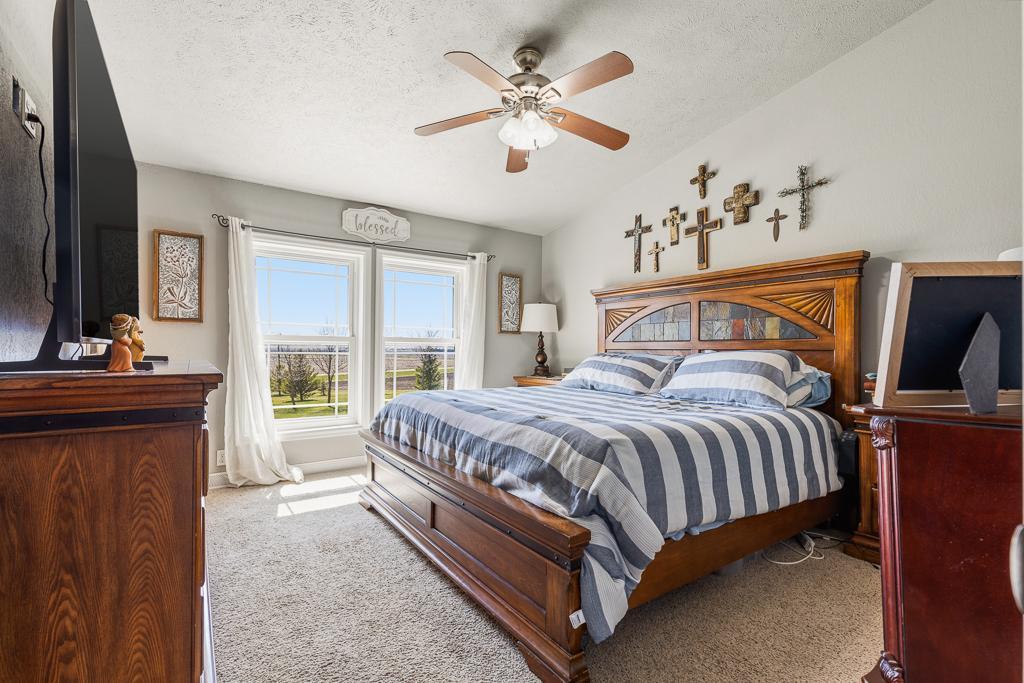 Spacious primary bedroom suite with more beautiful views to the front yard