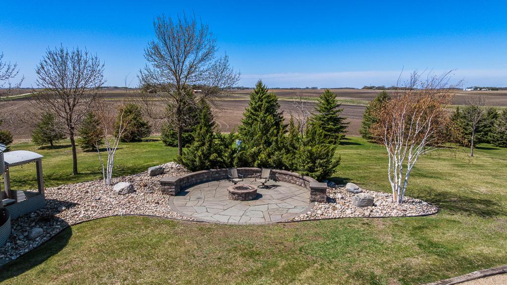 Custom patio with raised fire pit ready for summer bon fires and so many s'mores!