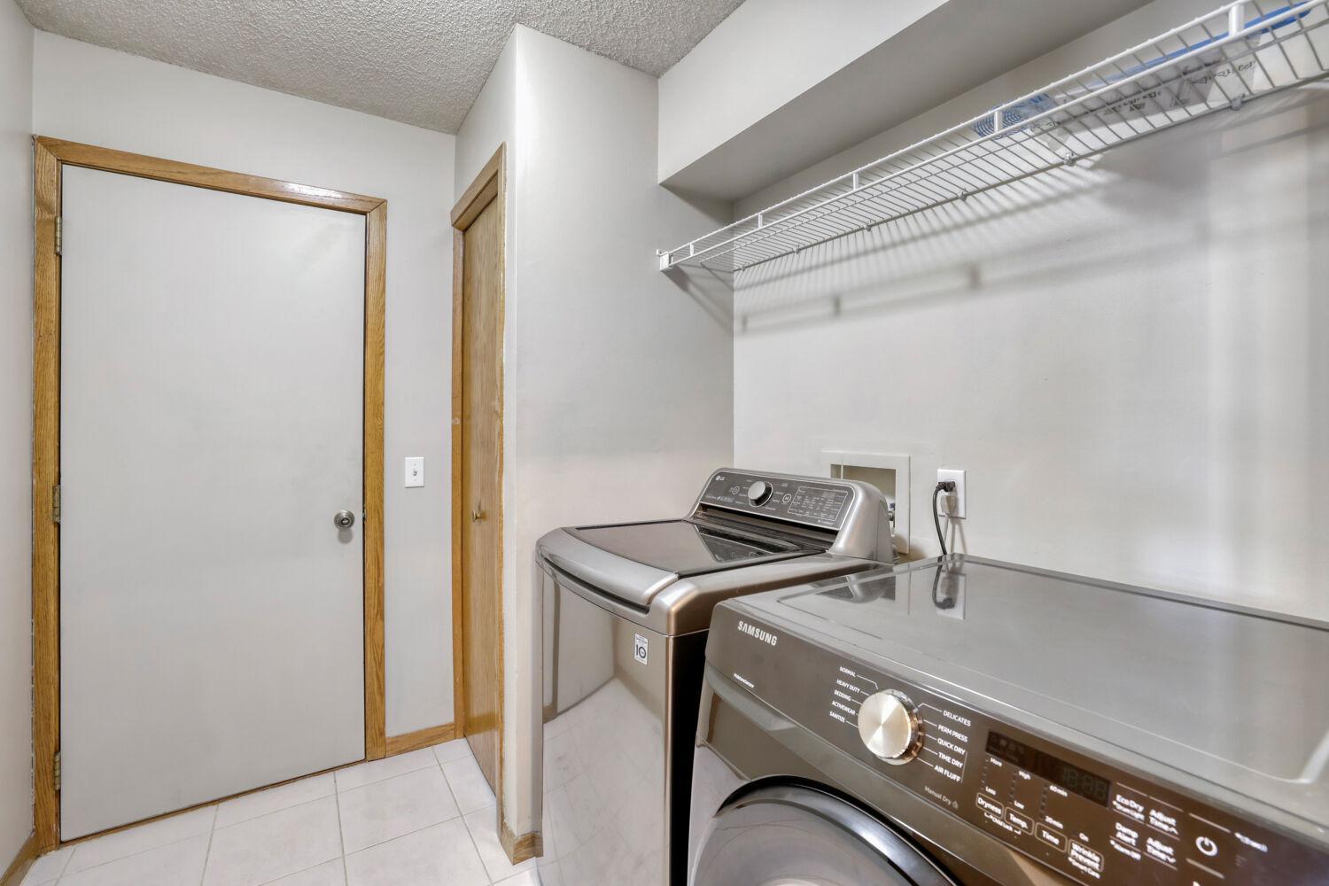 Main level laundry and mud room with access to the garage
