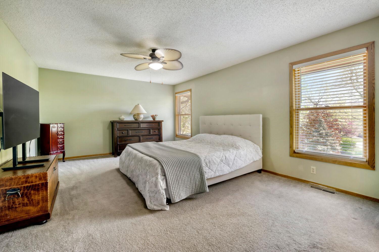 Upper Level Primary Suite with a walk-in closet & 4-part ensuite bath