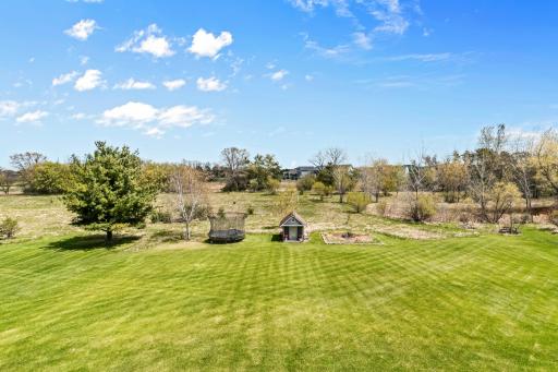 Useable flat yard extends to natural paths