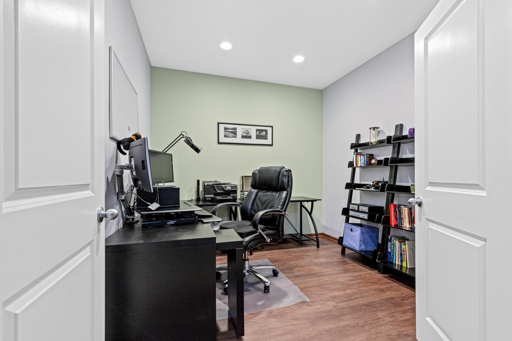 An office with double doors explands the finished living space and offers privacy for work or study.