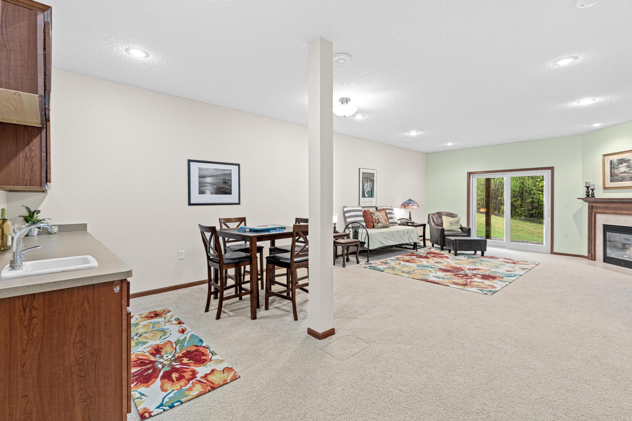 The open lower level family room offers a versatile space suited for entertaining or extended living needs. You will appreciate the high ceilings throughout the space.