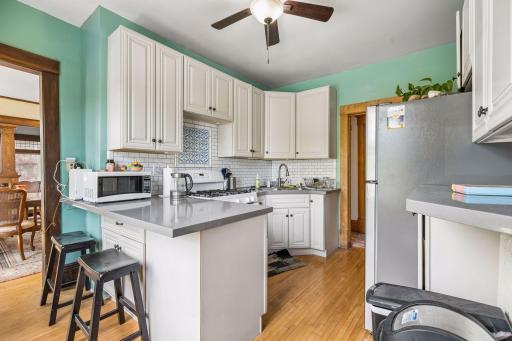Kitchen with stone countertops and tiled backsplash