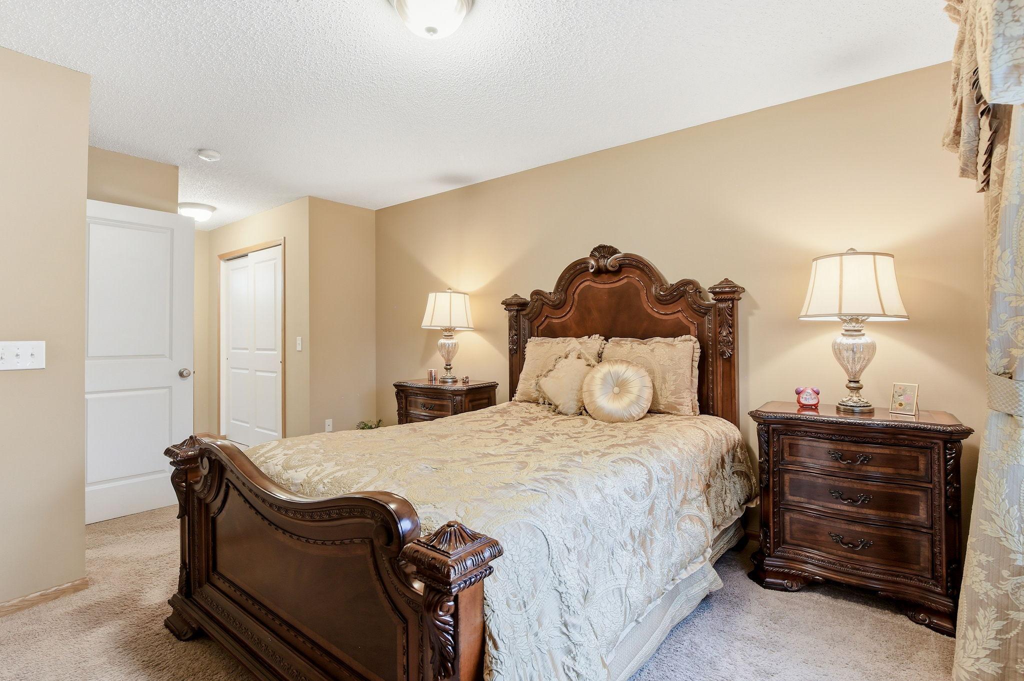 The primary suite features double closets with built-in organizers and a convenient walk-through primary bathroom.