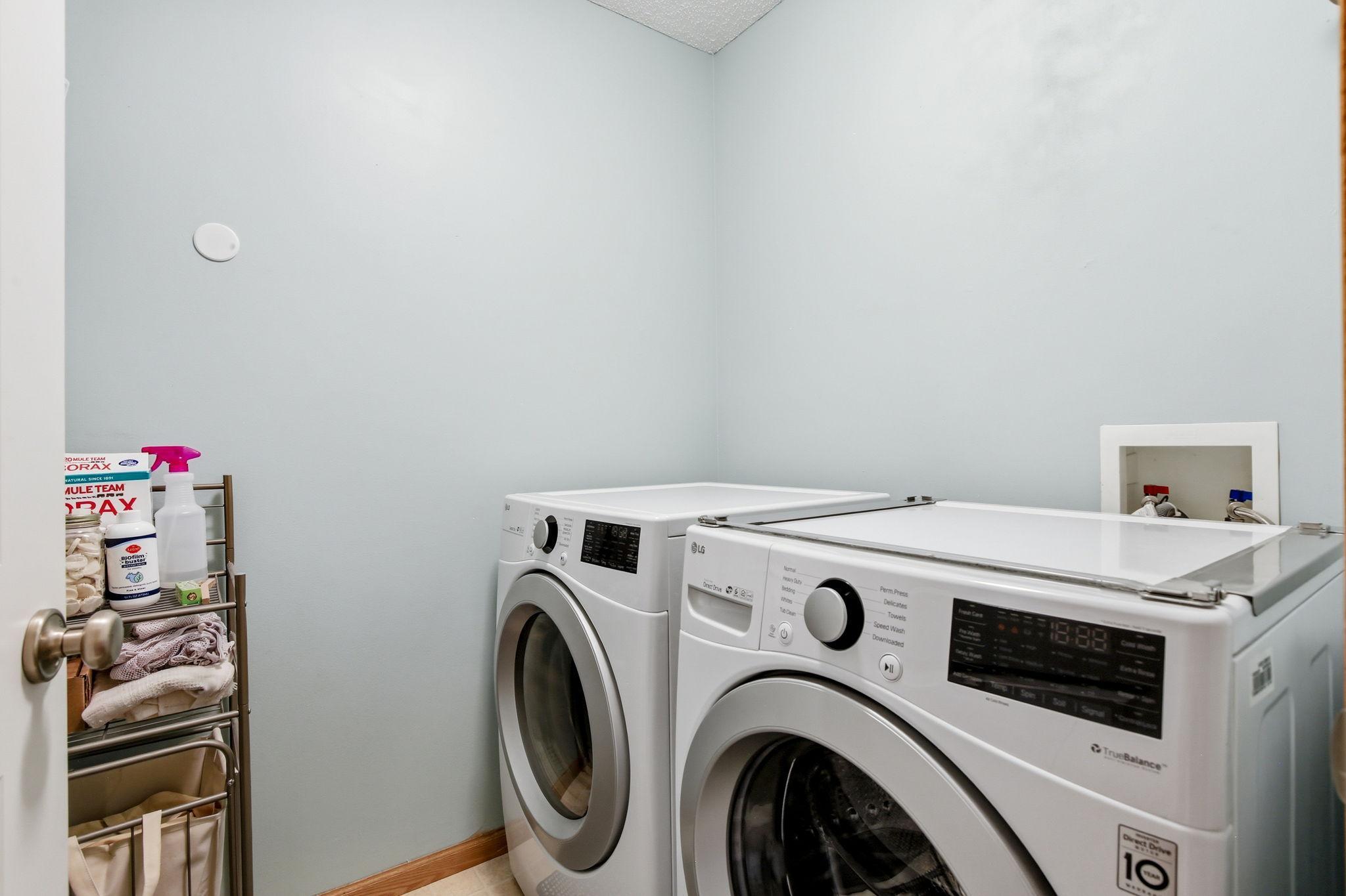 A designated upper-level laundry room is conveniently located near the bedrooms, with washer and dryer included for added ease and value.