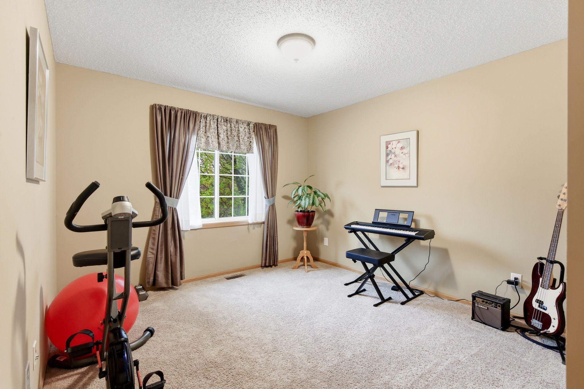 The second bedroom is currently being used as a hobby space, offering flexibility to suit a variety of needs.