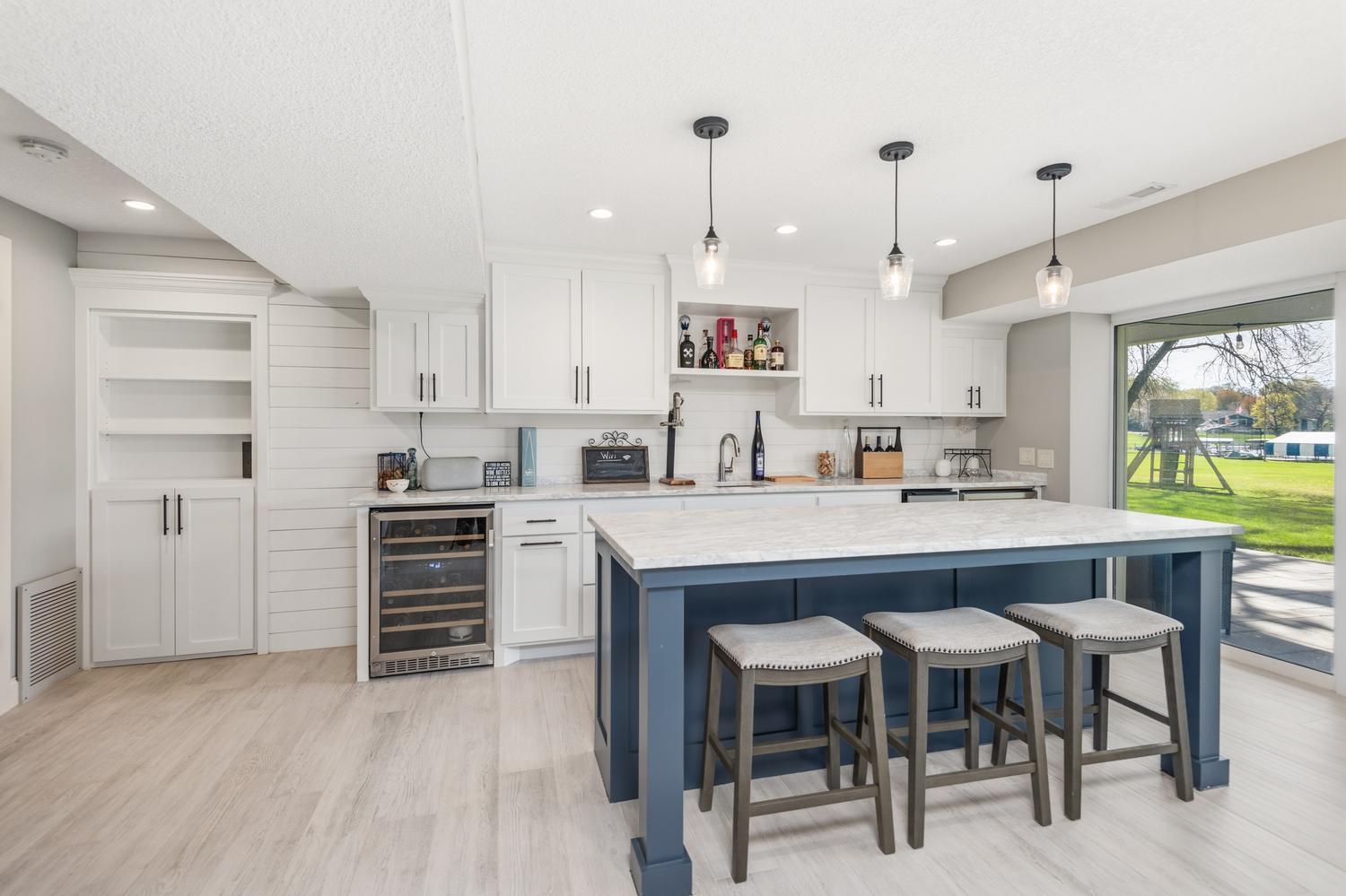 The owners spared no expense when recently refinishing the walkout lower level family room! Outstanding wet bar area with large island!