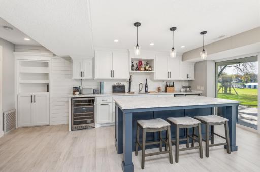 The owners spared no expense when recently refinishing the walkout lower level family room! Outstanding wet bar area with large island!