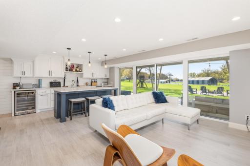Enjoy views of the large, level back yard and Lake Minnetonka. You will appreciate warm tile floors, recessed lighting and gas fireplace.