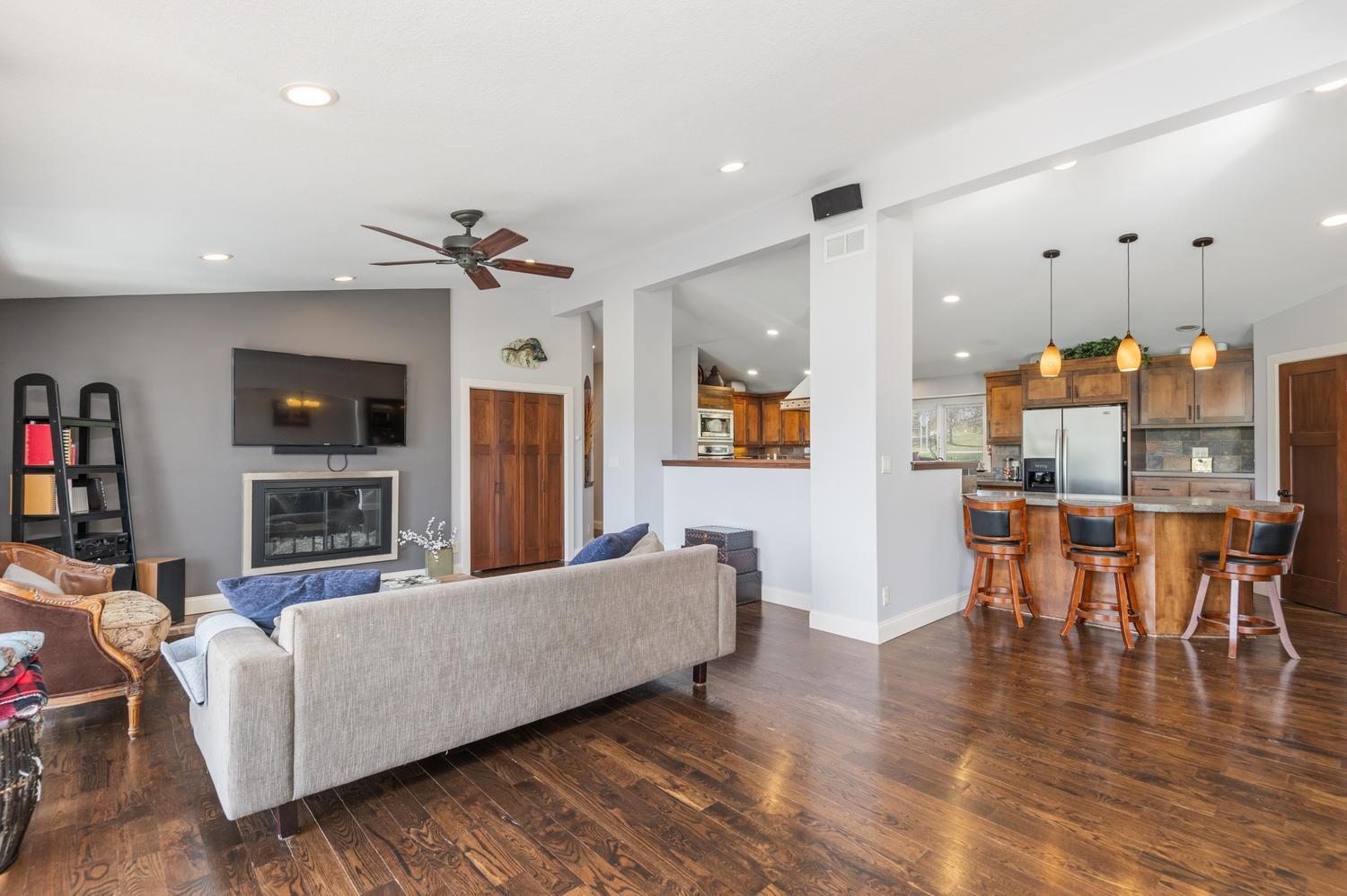 The upgraded finishes throughout the home include beautiful wood plank floors, rich panel doors and enameled millwork.