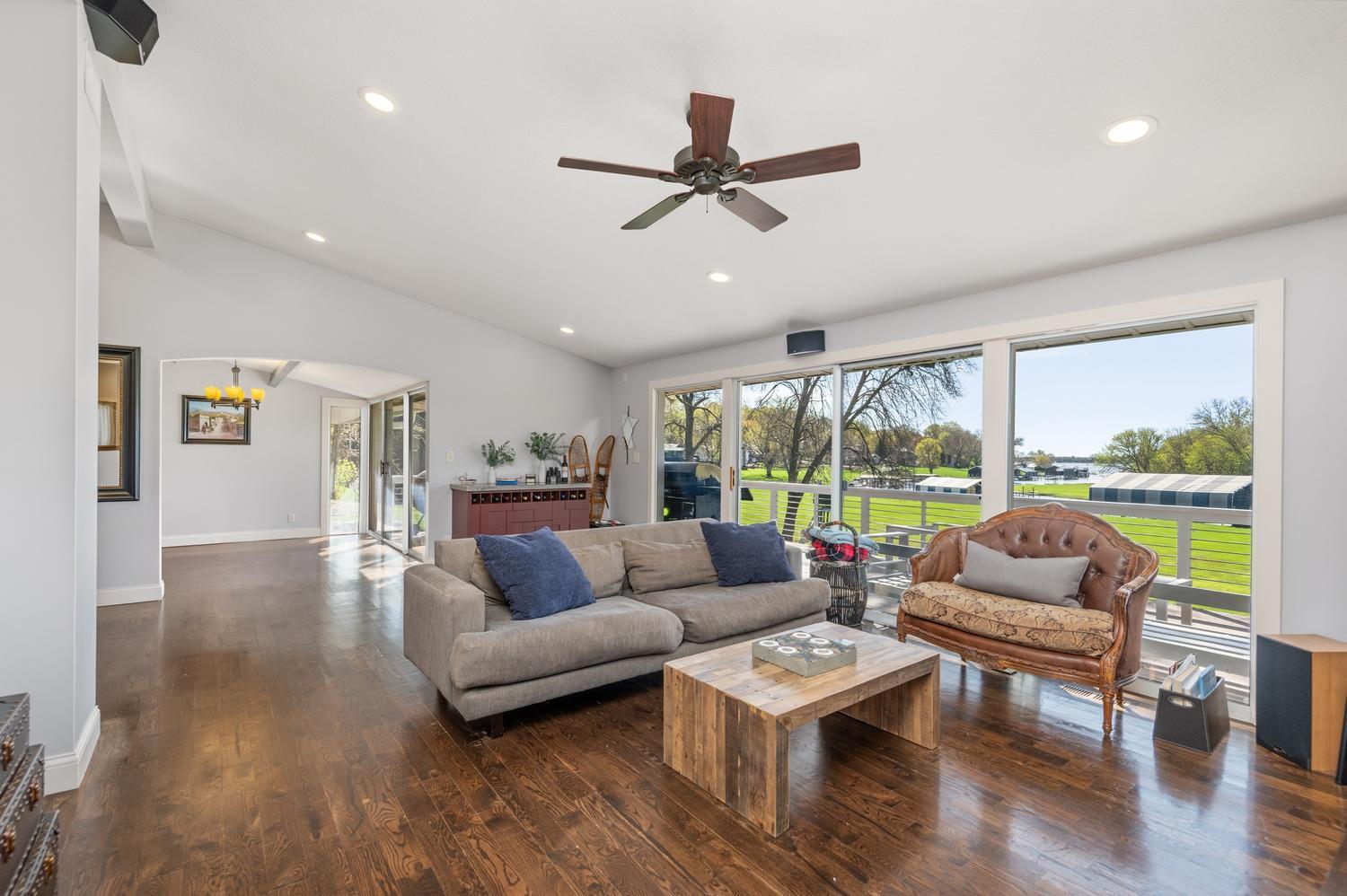 The vaulted main floor great room overlooks the fantastic back yard and sees down the channel to Jennings Bay.