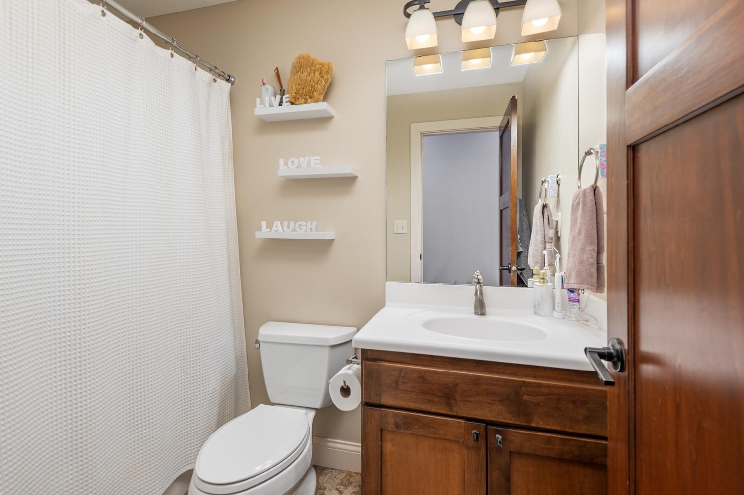 Remodeled main floor full bath with heated floor.