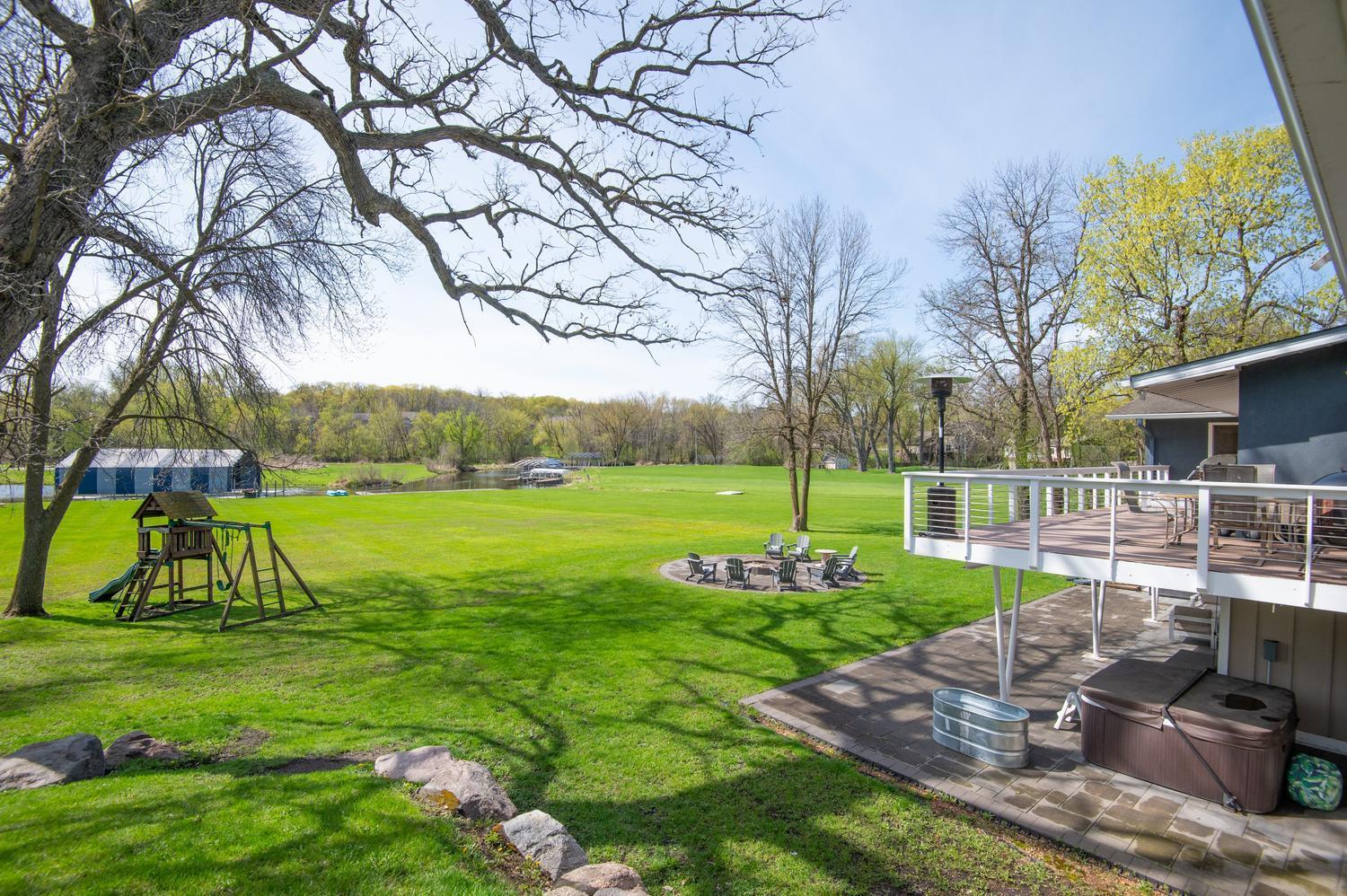 When you walk around the house on the garage side you have this view of the back yard and lake. There is great garage storage too.