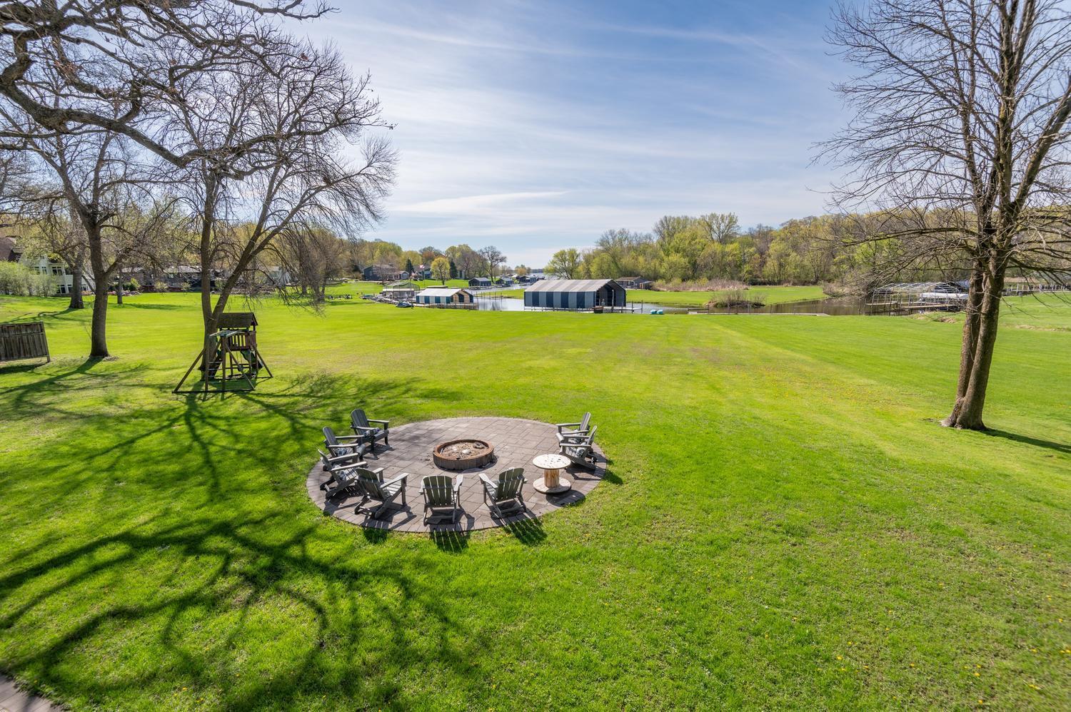 Entertain friends and family at the circular patio, firepit and fantastic lawn. It is an easy walk to the dock on this level lot.