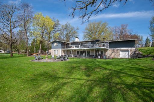 Fantastic level yard for kids to play and pets to run. There is a lower garage door and extra parking on the west end of the home too.