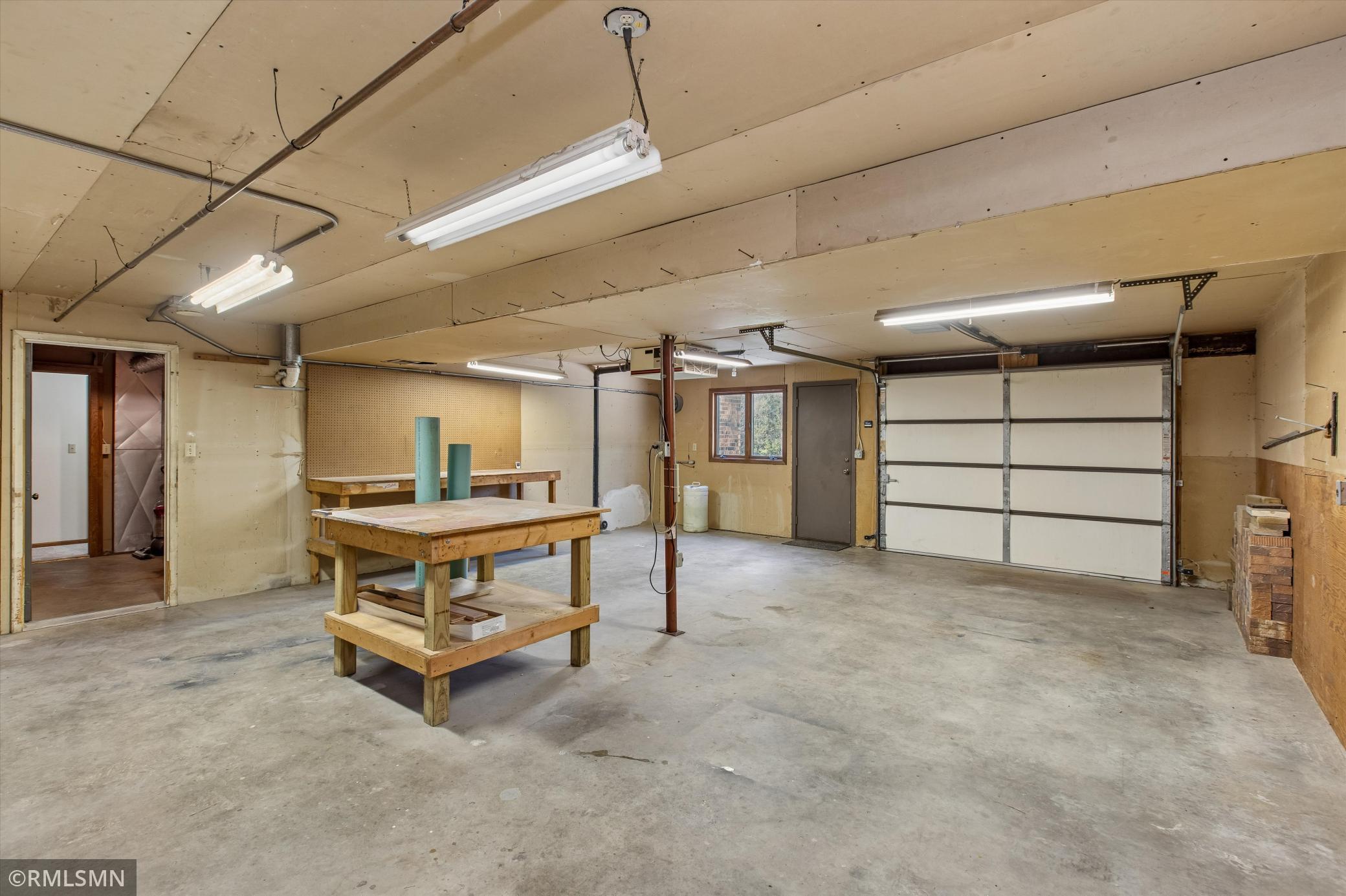 Shop has air filtration system and overhead garage door