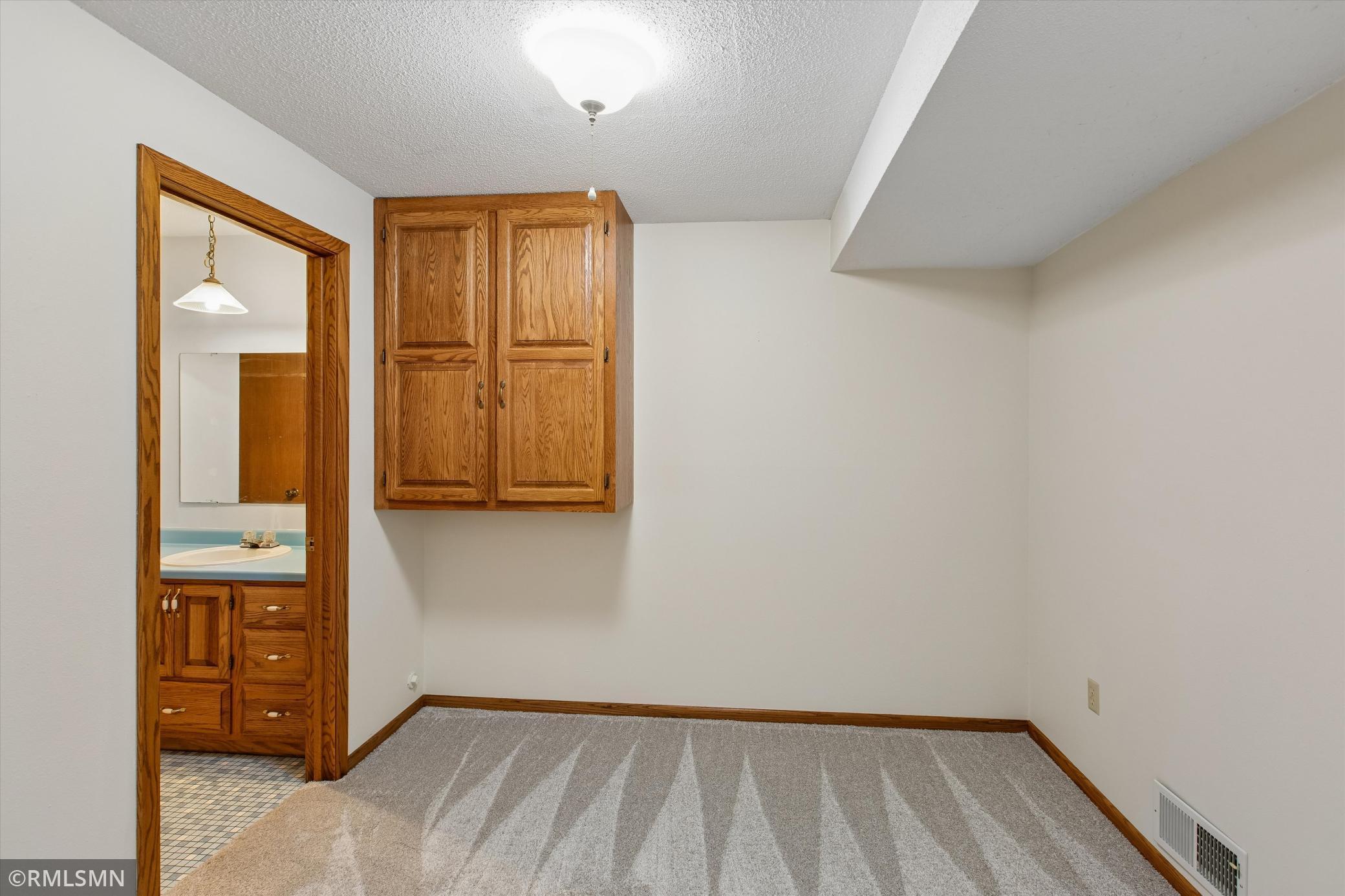 Lower level office/workout room with a 3/4 bath attached