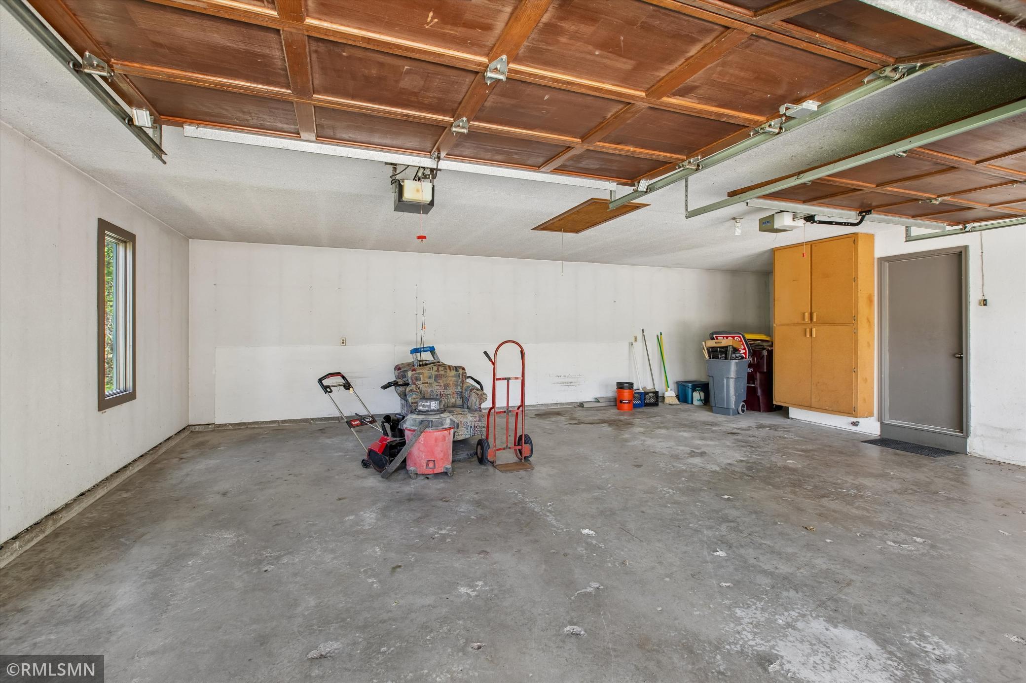 Attached garage with drop down ladder for extra storage space