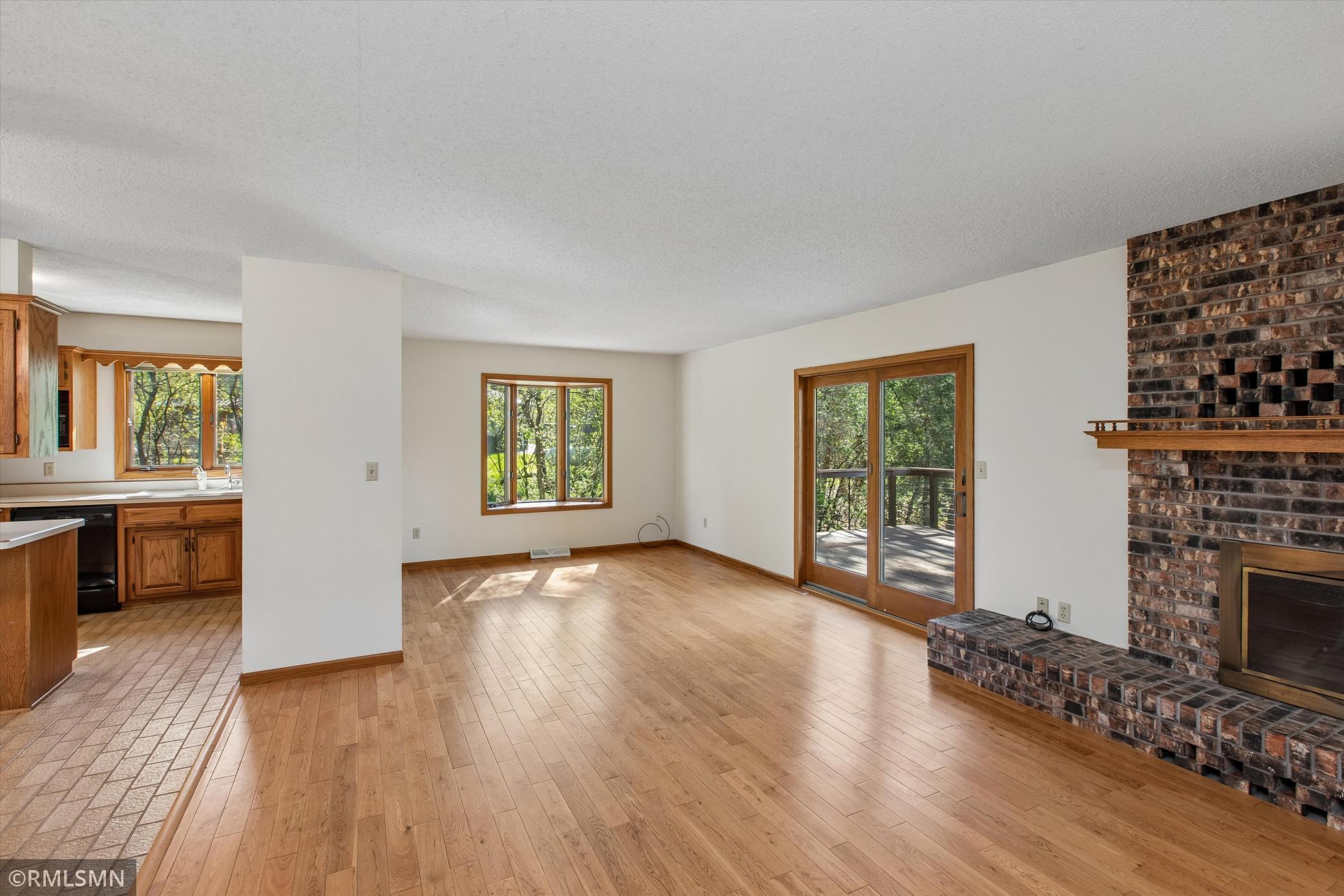 Living room with patio door leading to backyard private deck!