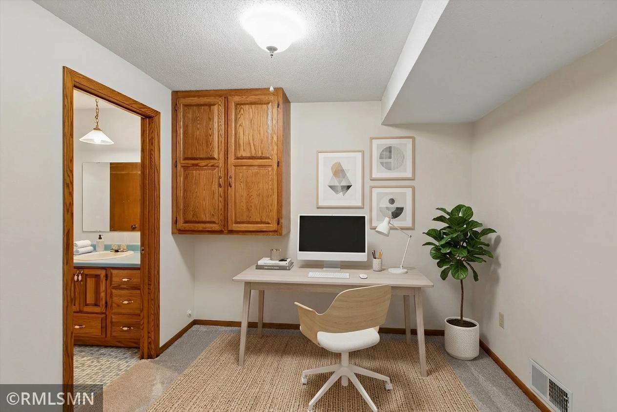 Lower level office/workout room - this photo has been virtually staged