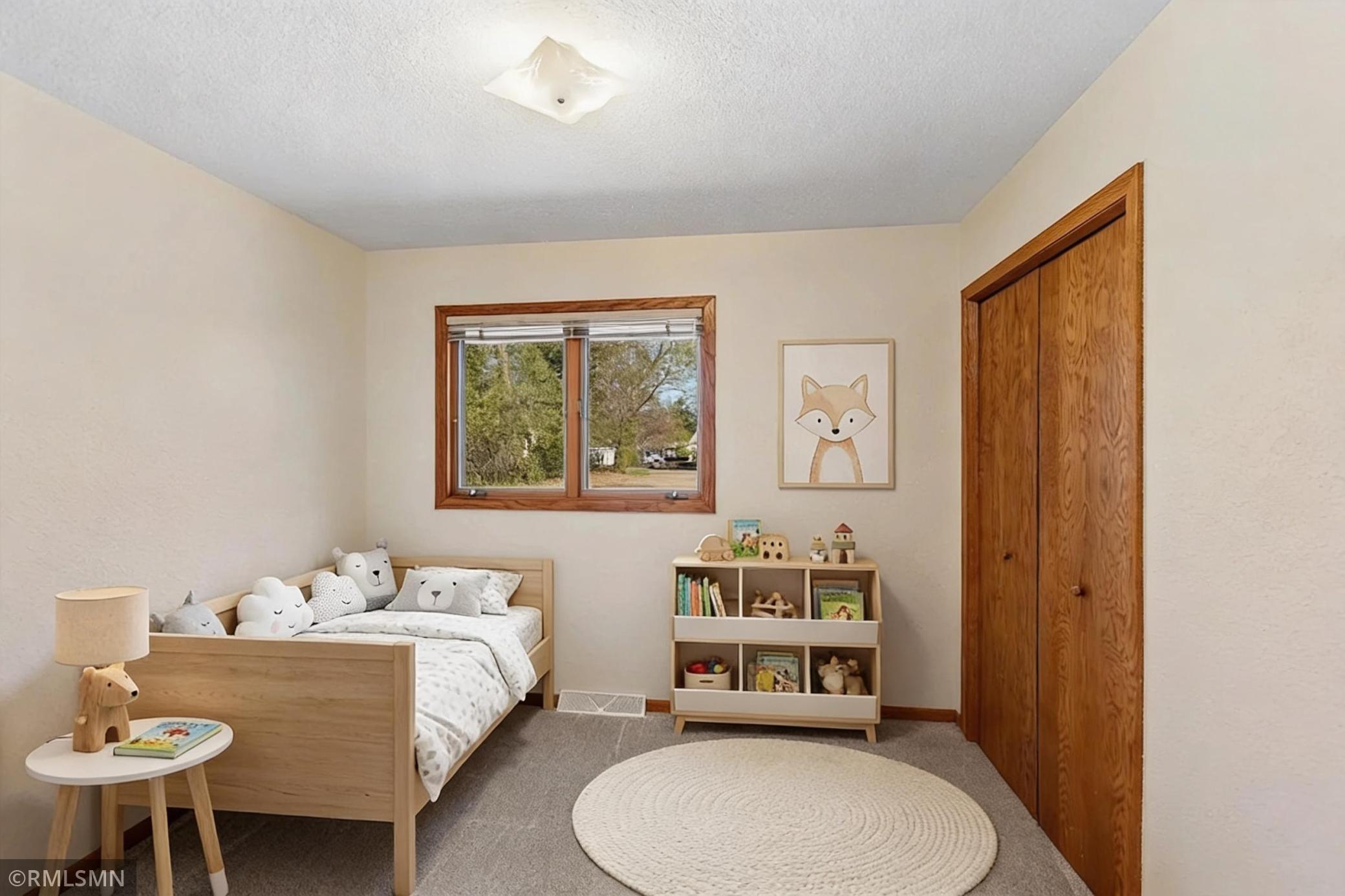 3rd bedroom on main level - this photo has been virtually staged