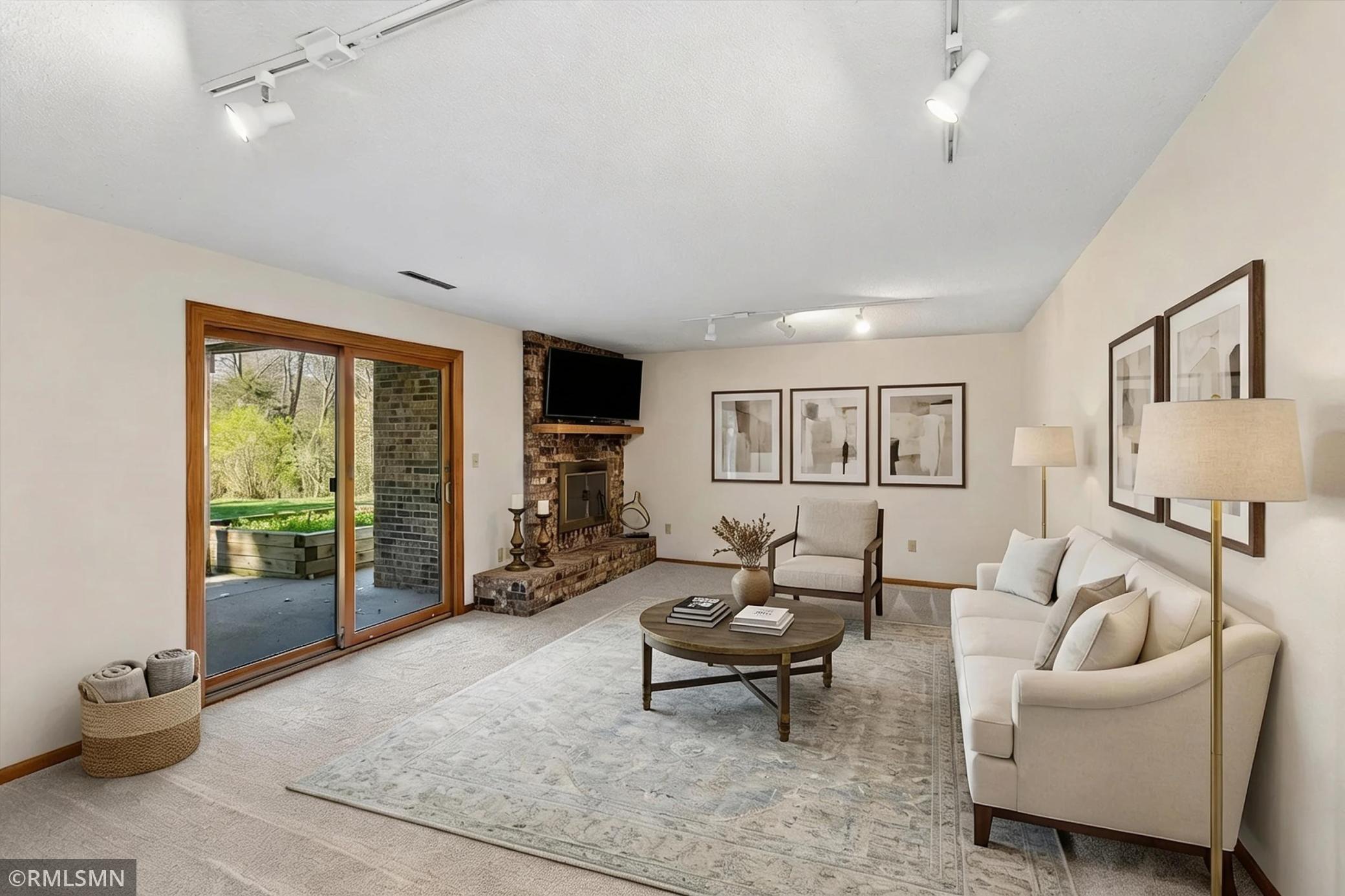 Lower level walkout family room - this photo has been virtually staged