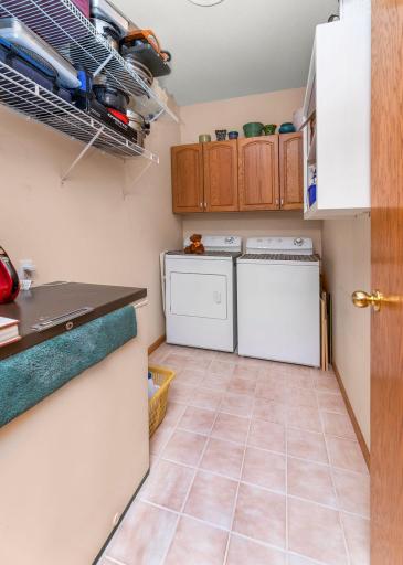 Dedicated laundry room wtih storage & hanging space