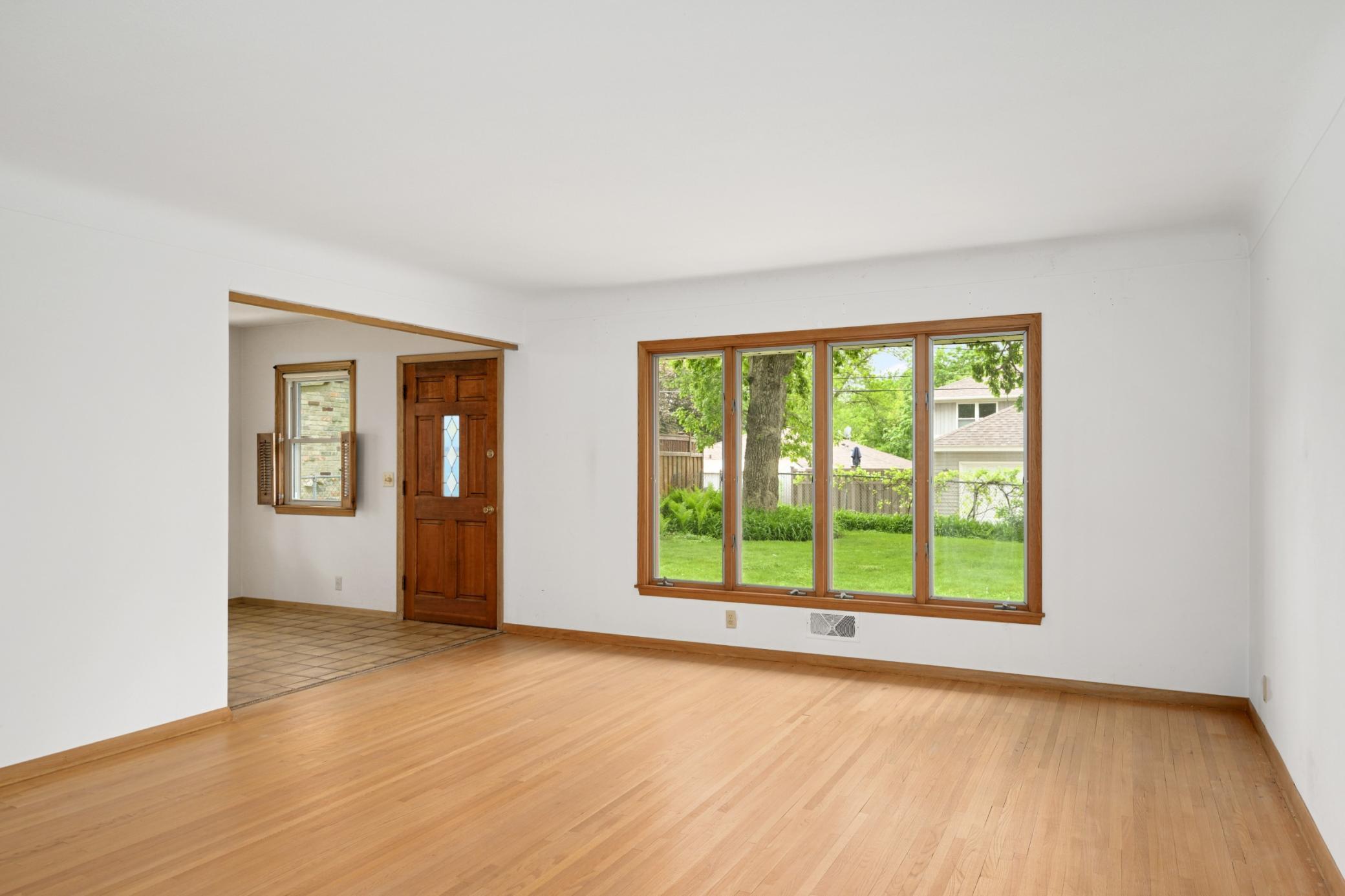 Large living room (20' x 15') with 4 windows looking-out on the back yard.