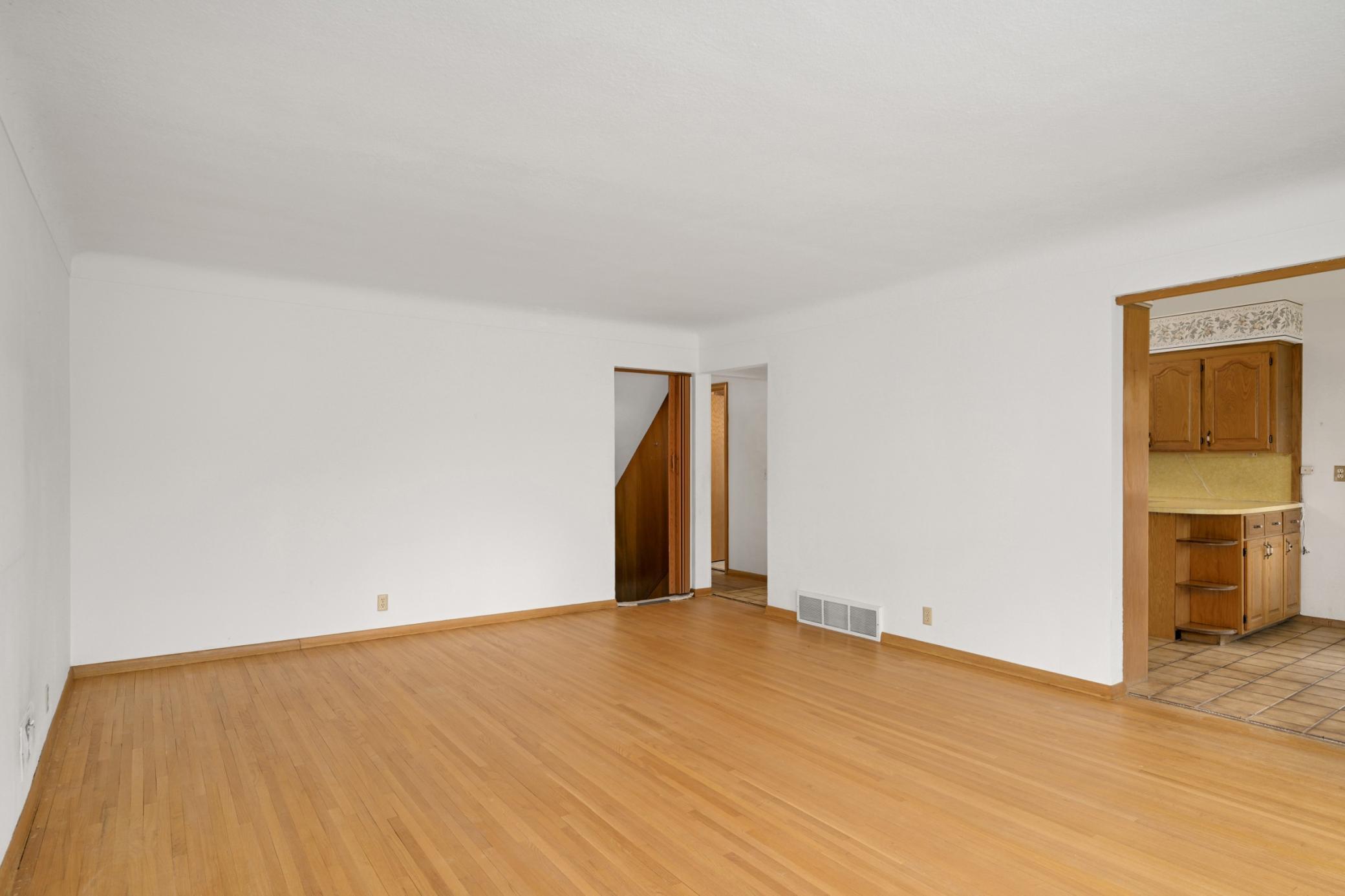 Living room with original hardwood floors.