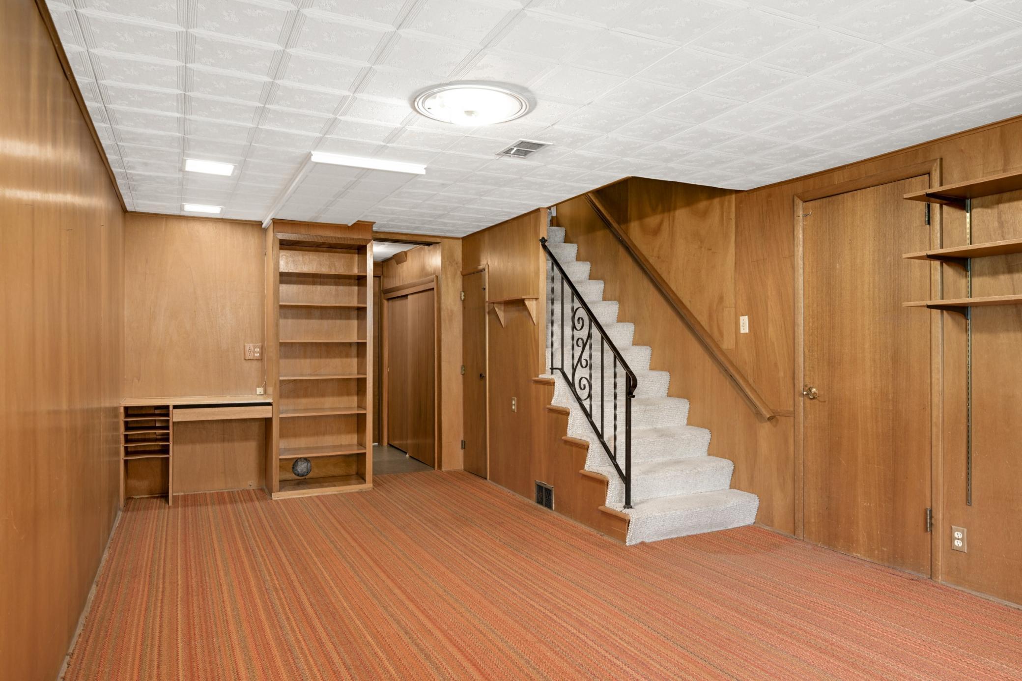 Family room with built-in desk and shelving.