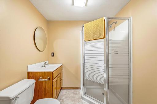 Convenient lower-level 3/4 bathroom with walk-in shower and updated vanity.