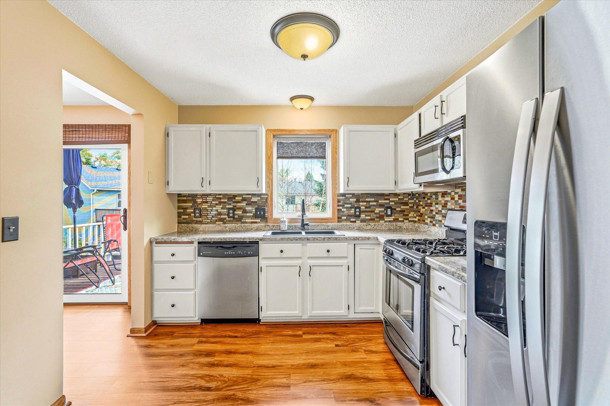 Functional kitchen layout featuring abundant cabinetry, stainless steel appliances, and beautiful updated finishes.