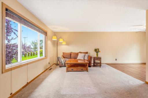 Comfortable main level living space with abundant natural light and an open flow into the dining area.