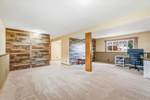 Expansive lower-level family room offers plenty of space for entertaining, recreation, or relaxing.