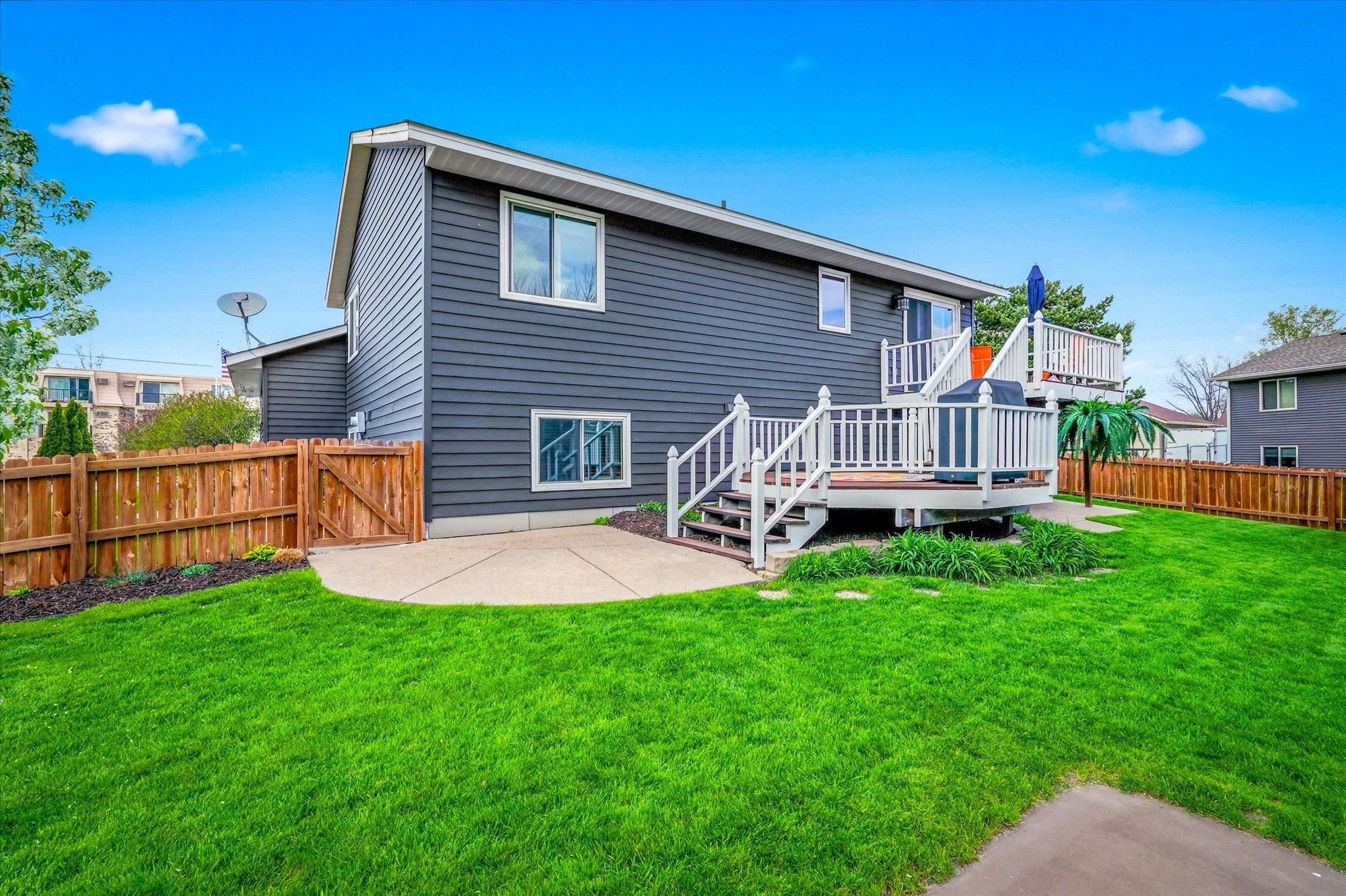 Enjoy the beautifully maintained fenced backyard with spacious multi-level deck and patio areas perfect for entertaining.